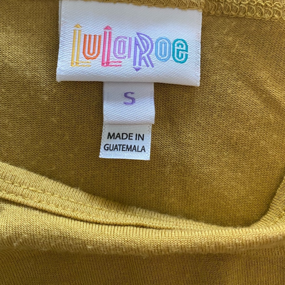 Shirt mid in front long in back.